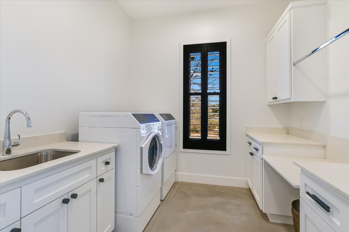 343 Pug Rippy Road Dripping Springs, TX 78620 - Photo 13 of 33 a utility room with dryer and washer