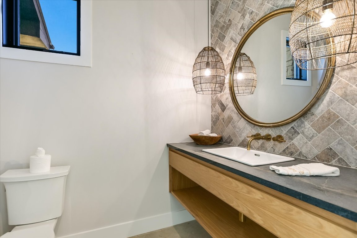 343 Pug Rippy Road Dripping Springs, TX 78620 - Photo 21 of 33 a bathroom with a sink and a mirror