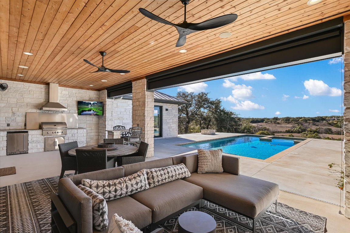 343 Pug Rippy Road Dripping Springs, TX 78620 - Photo 26 of 33 a outdoor living space with furniture and garden view