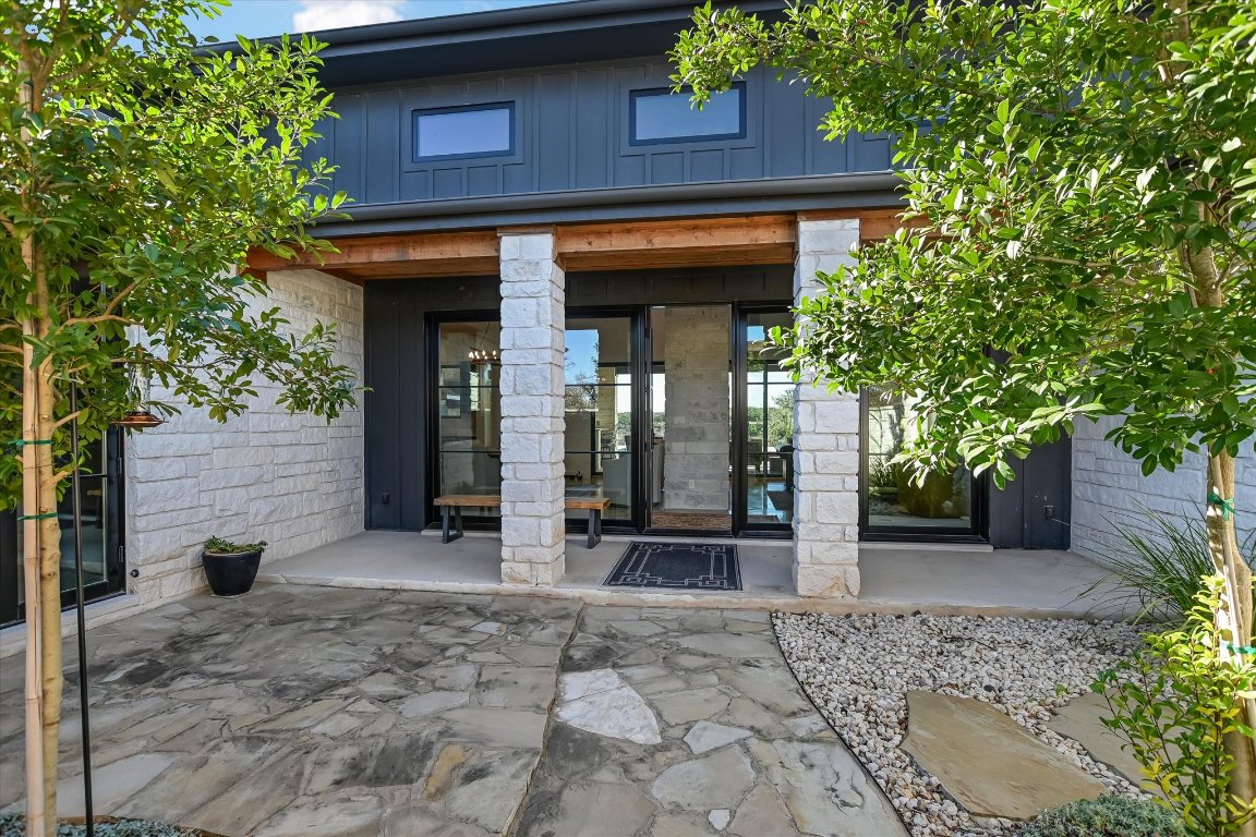 343 Pug Rippy Road Dripping Springs, TX 78620 - Photo 5 of 33 a view of a entryway door of the house