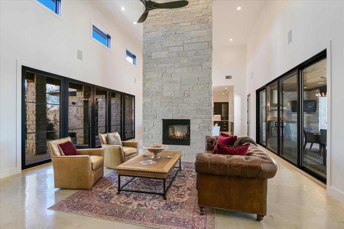 343 Pug Rippy Road Dripping Springs, TX 78620 - Photo 7 of 33 a living room with furniture and large windows