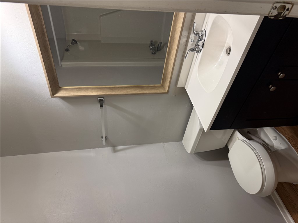 1014 Autumn Circle, Unit A College Station, TX 77840 - Photo 11 of 16 a bathroom with a sink toilet and shower