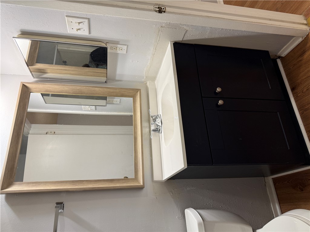 1014 Autumn Circle, Unit A College Station, TX 77840 - Photo 14 of 16 a bathroom with a sink and a mirror