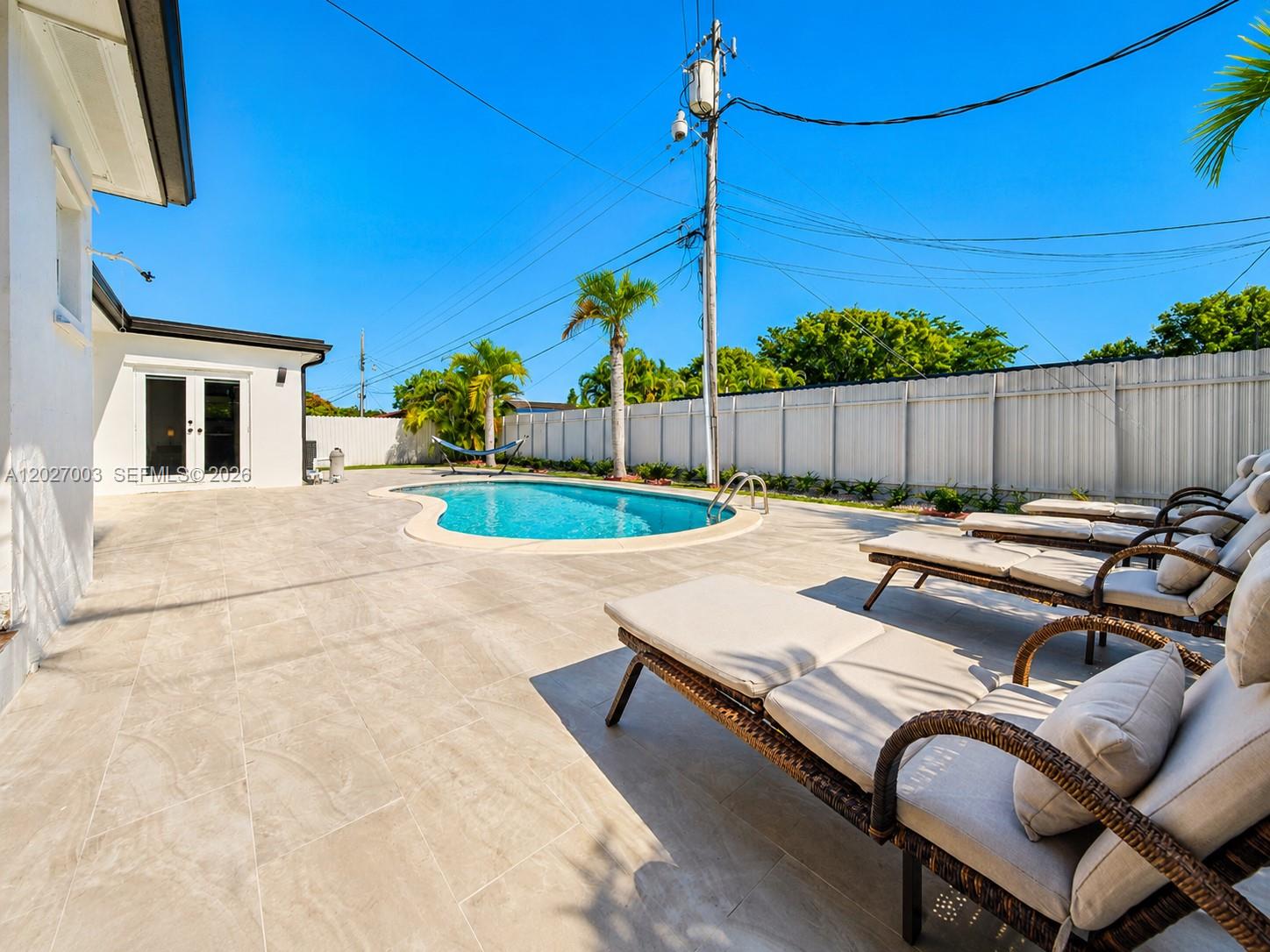 2761 Southwest 92nd Place Miami, FL 33165 - Photo 27 of 37 a view of swimming pool with a backyard
