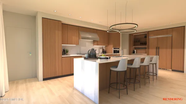 a kitchen with a sink cabinets and wooden floor