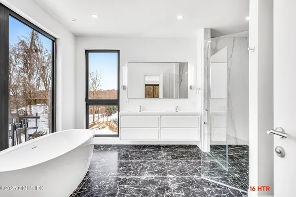 a bathroom with a bathtub and a shower