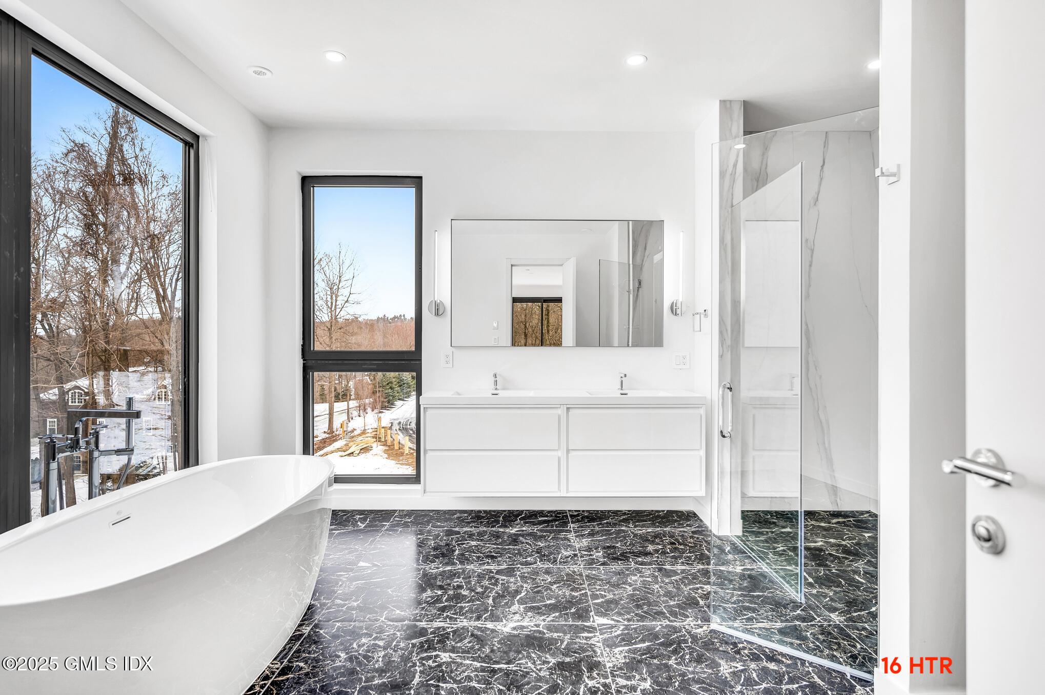 18 Edgar Road Greenwich, CT 06831 - Photo 15 of 23 a bathroom with a bathtub and a shower