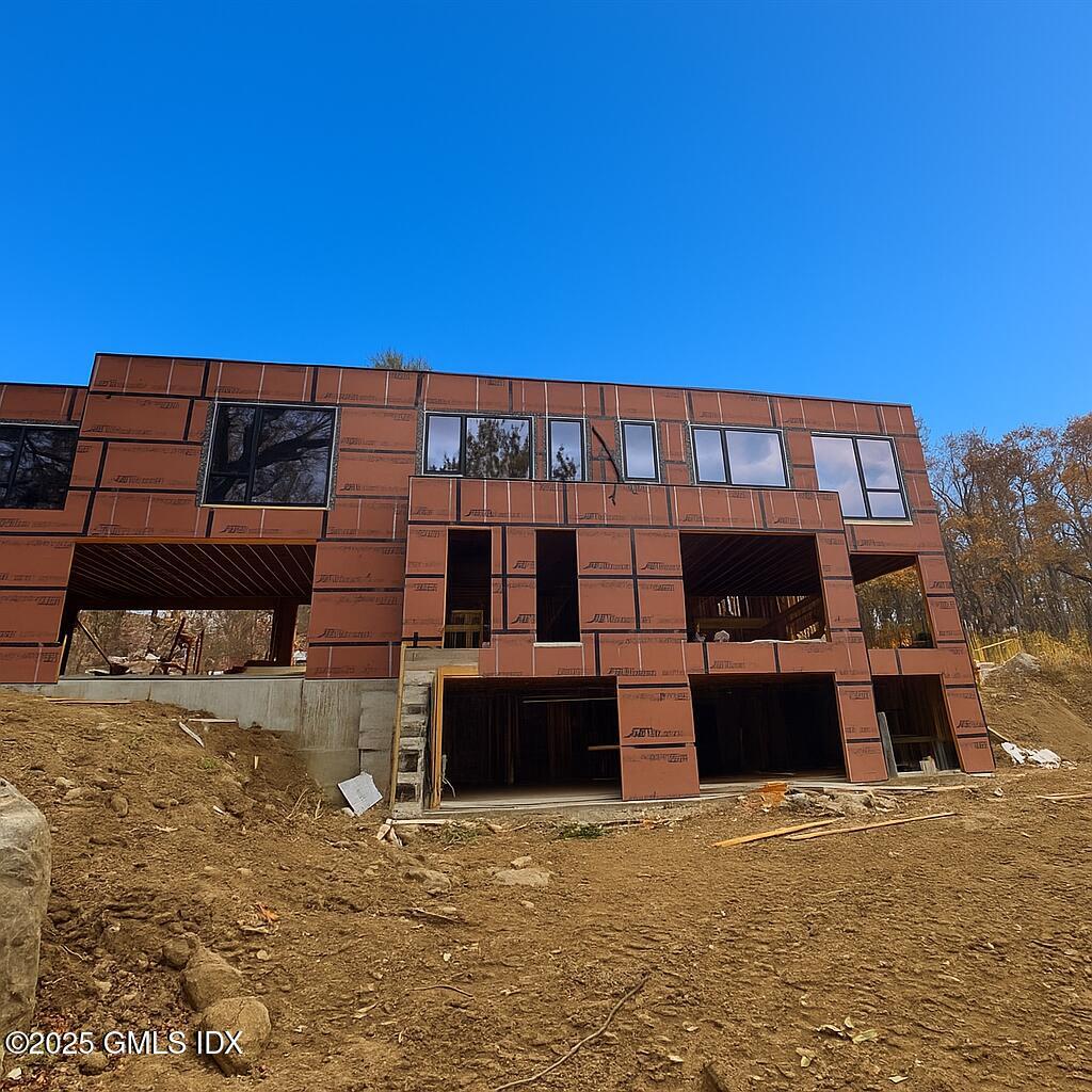 18 Edgar Road Greenwich, CT 06831 - Photo 23 of 23 a front view of a building with a yard