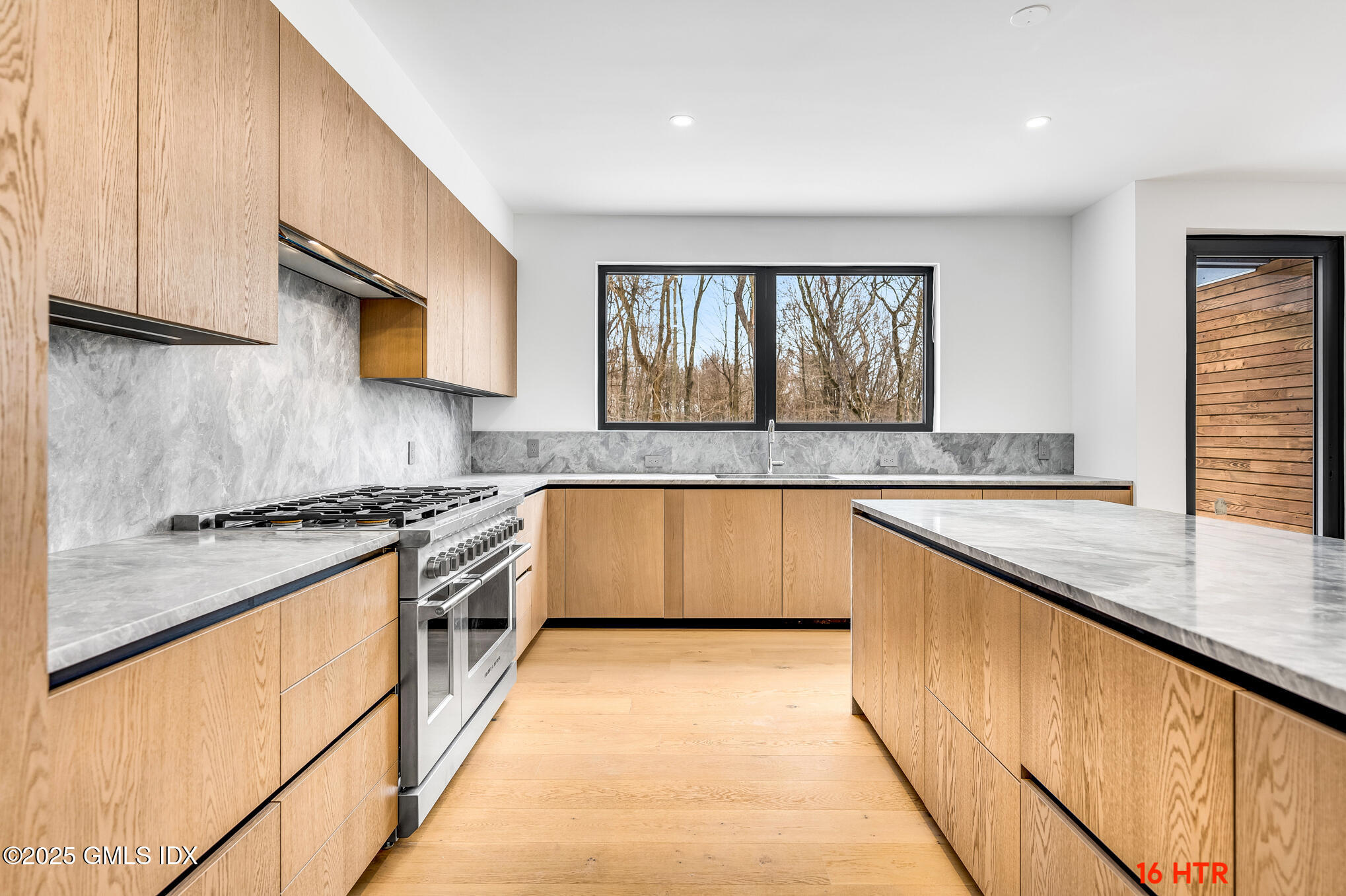 18 Edgar Road Greenwich, CT 06831 - Photo 10 of 23 a large kitchen with granite countertop a stove and a sink