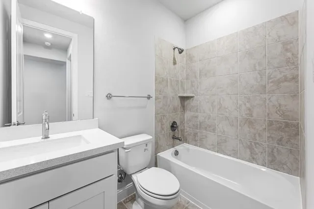a view of a livingroom with a ceiling fan and window
