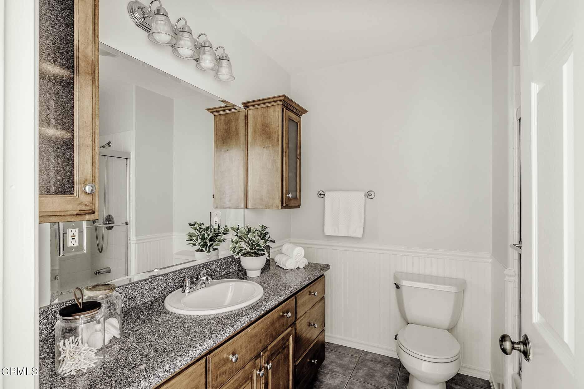 1779 Morada Place Altadena, CA 91001 - Photo 26 of 54 a bathroom with a granite countertop double vanity sink and a mirror