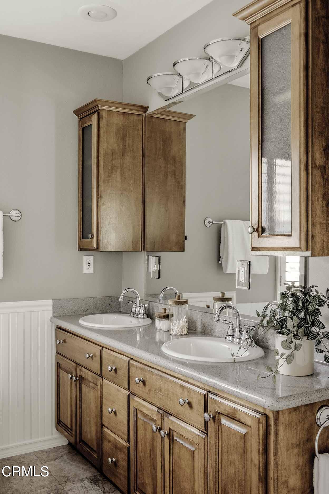 1779 Morada Place Altadena, CA 91001 - Photo 34 of 54 a bathroom with double vanity sink a two mirror and a window