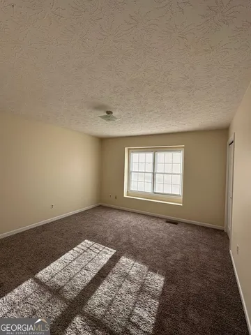 an empty room with a bed