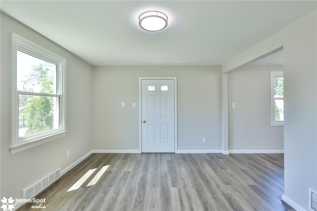 415 Willow Road Hellertown, PA 18055 - Photo 11 of 25 A well-lit interior boasts durable vinyl plank flooring and abundant natural light.