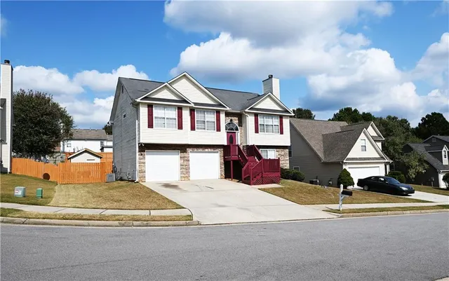 a view of a house with entertaining space and windows