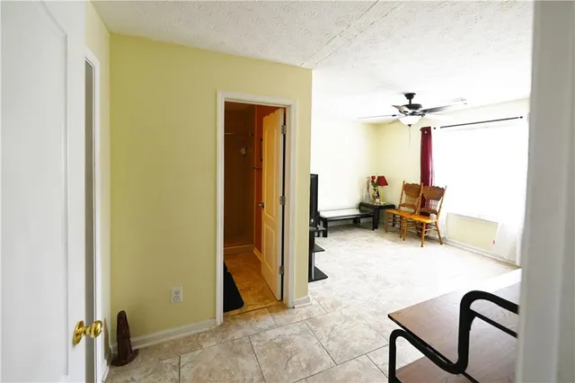 a room with a chair and a chandelier