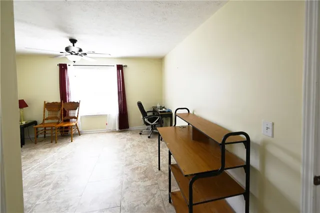 a view of a workspace with furniture