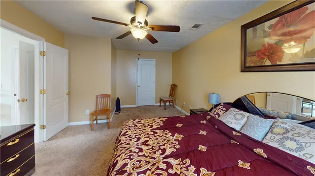 a bedroom with double bed furniture and a window