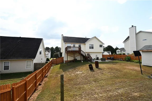 a roof deck with table and chairs a barbeque