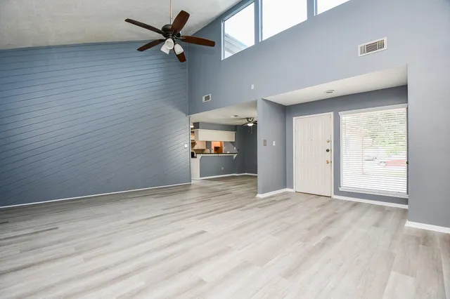 wooden floor in an empty room and a window