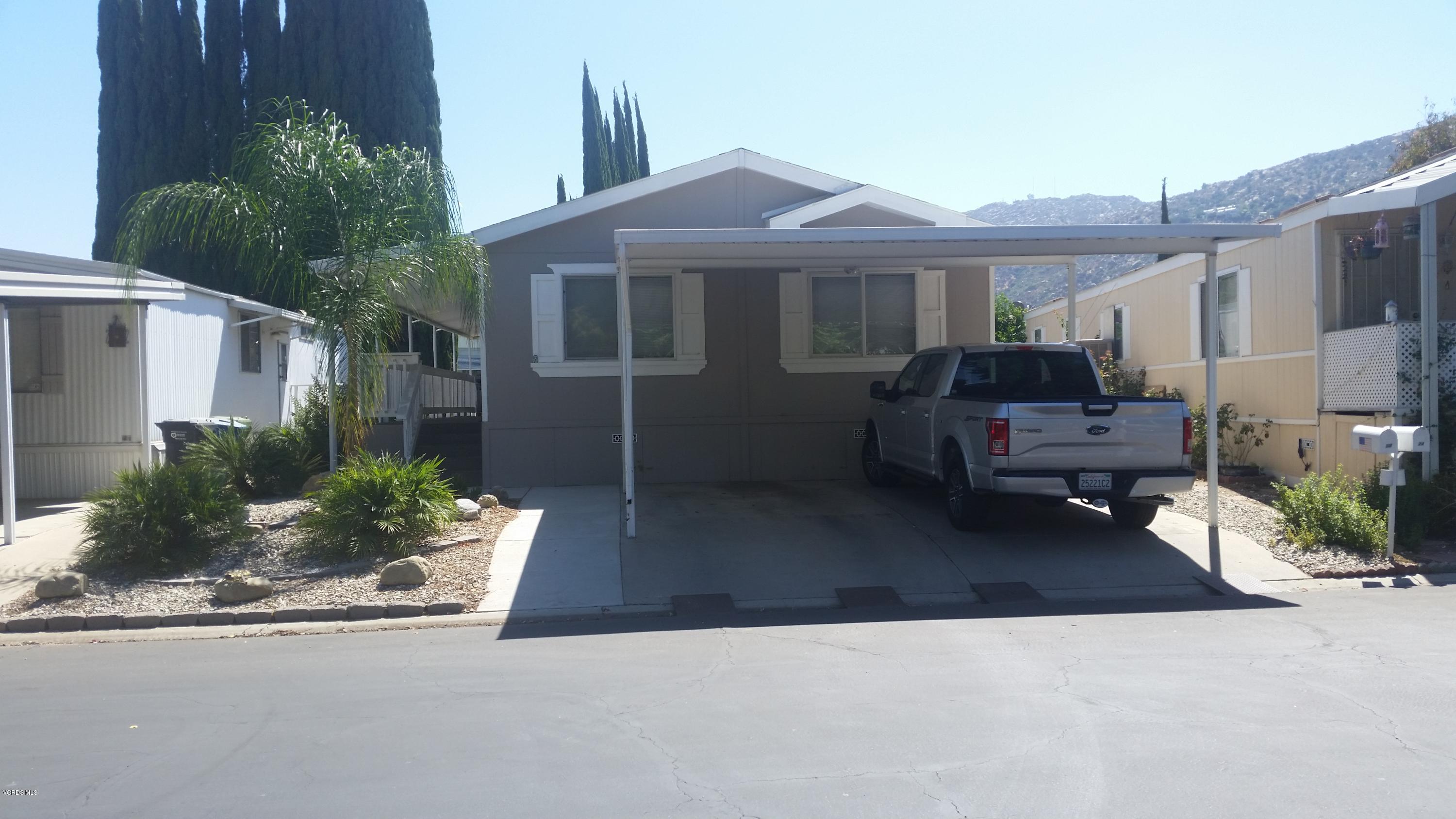 6480 Katherine Road, Unit 23 Simi Valley, CA 93063 - Photo 1 of 37 a front view of a house with garden