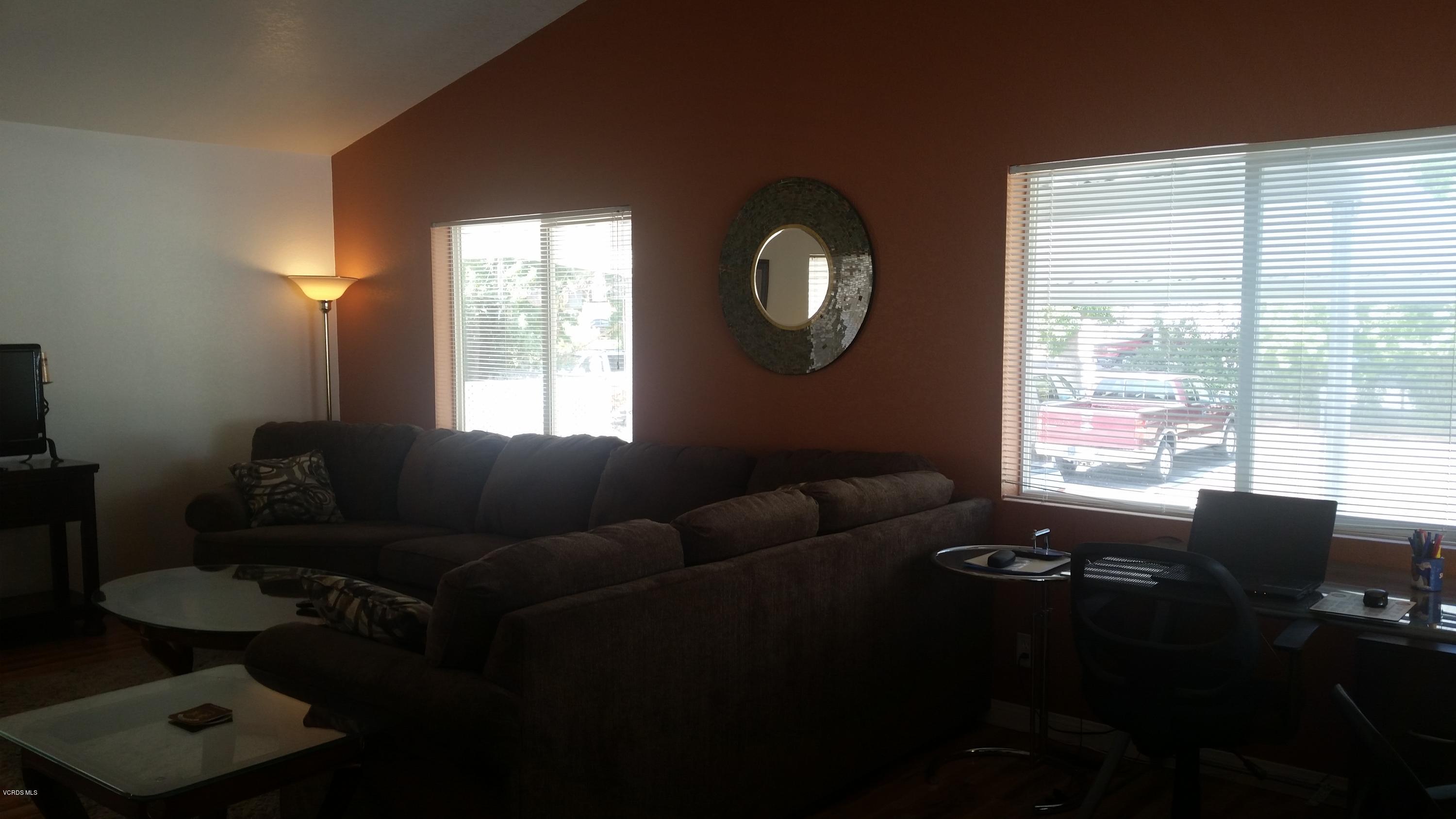 6480 Katherine Road, Unit 23 Simi Valley, CA 93063 - Photo 12 of 37 a living room with furniture and a window