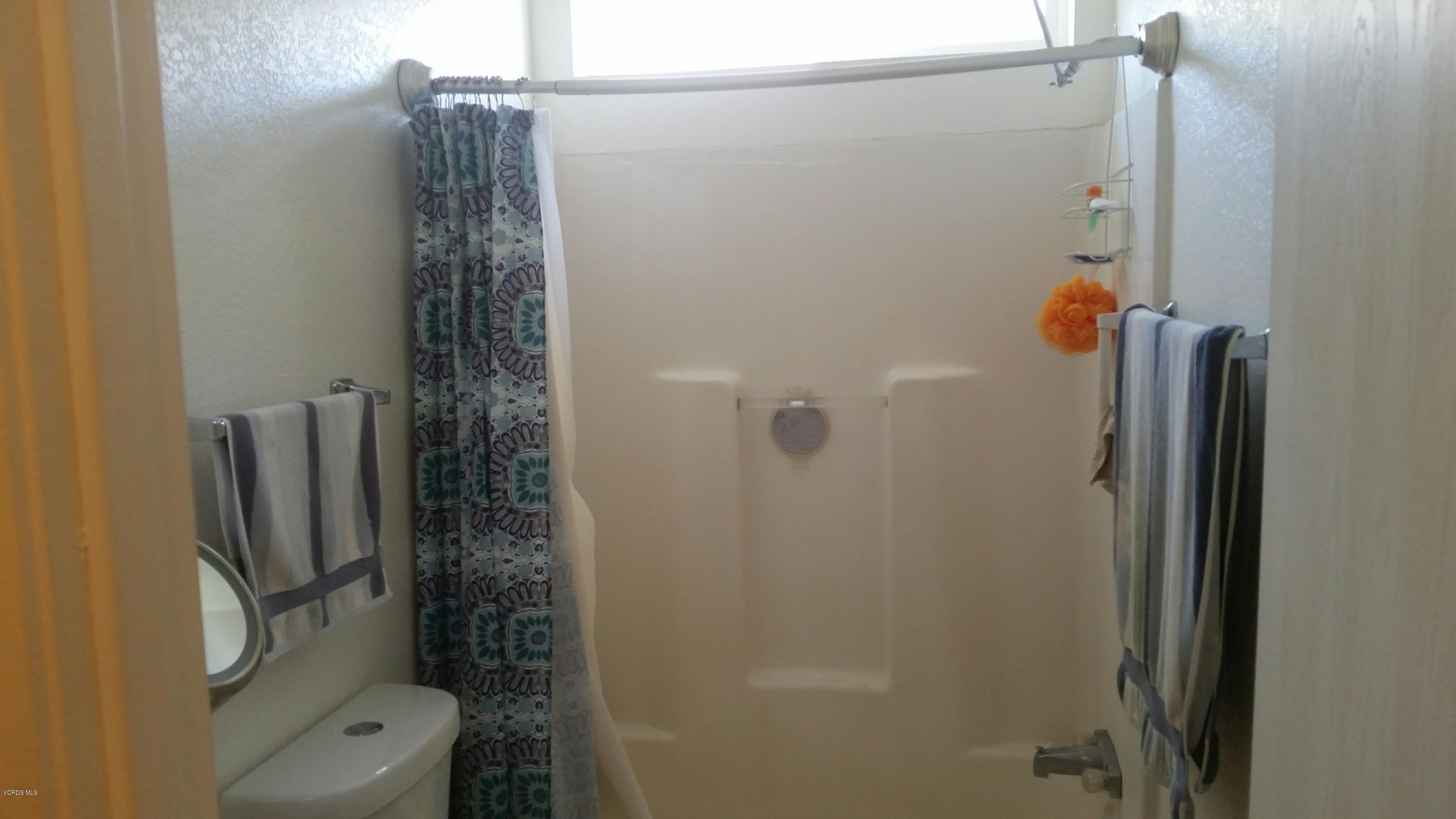 6480 Katherine Road, Unit 23 Simi Valley, CA 93063 - Photo 21 of 37 a bathroom with a shower and toilet