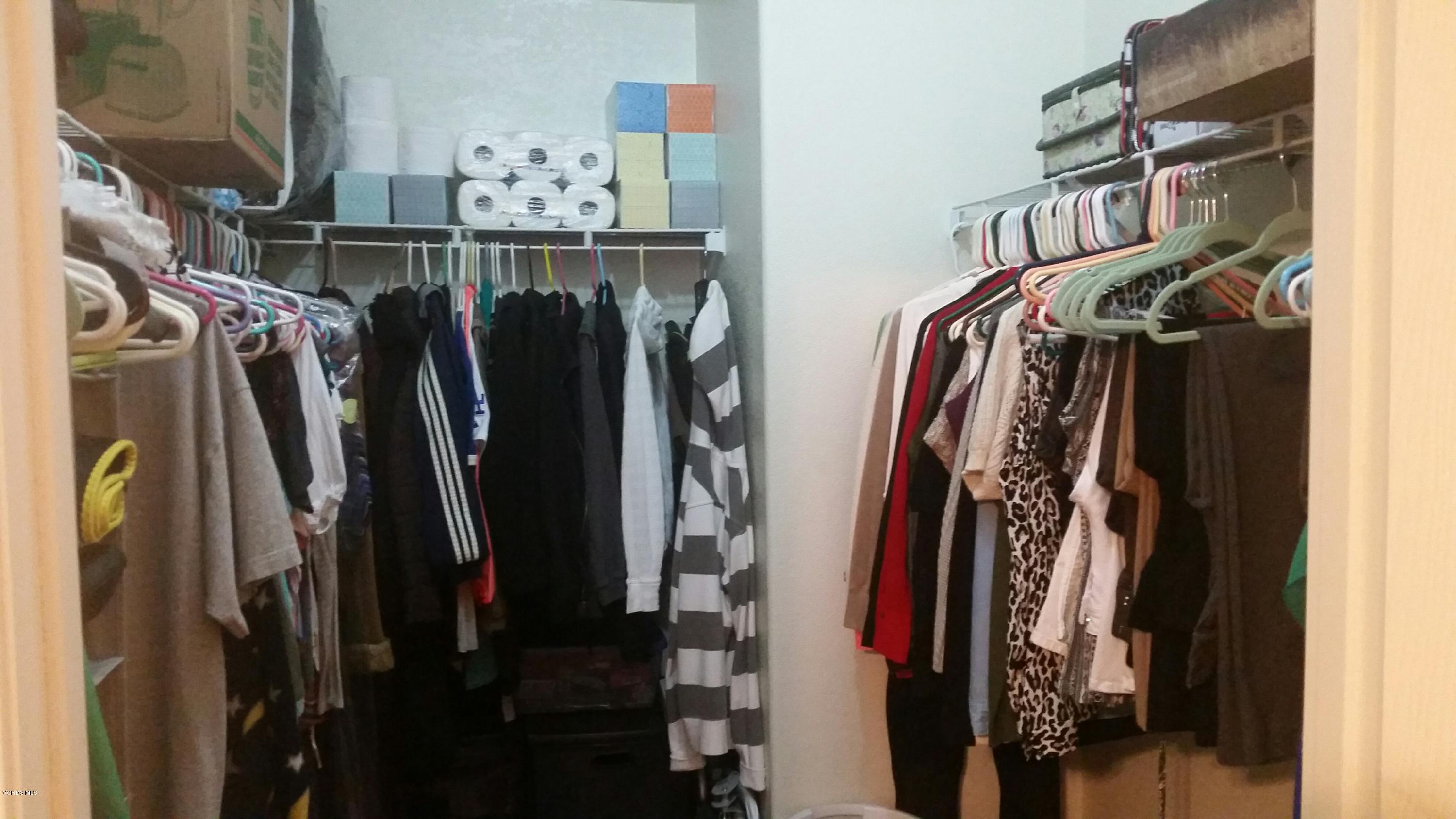 6480 Katherine Road, Unit 23 Simi Valley, CA 93063 - Photo 25 of 37 a view of walk in closet with clothes and shoes