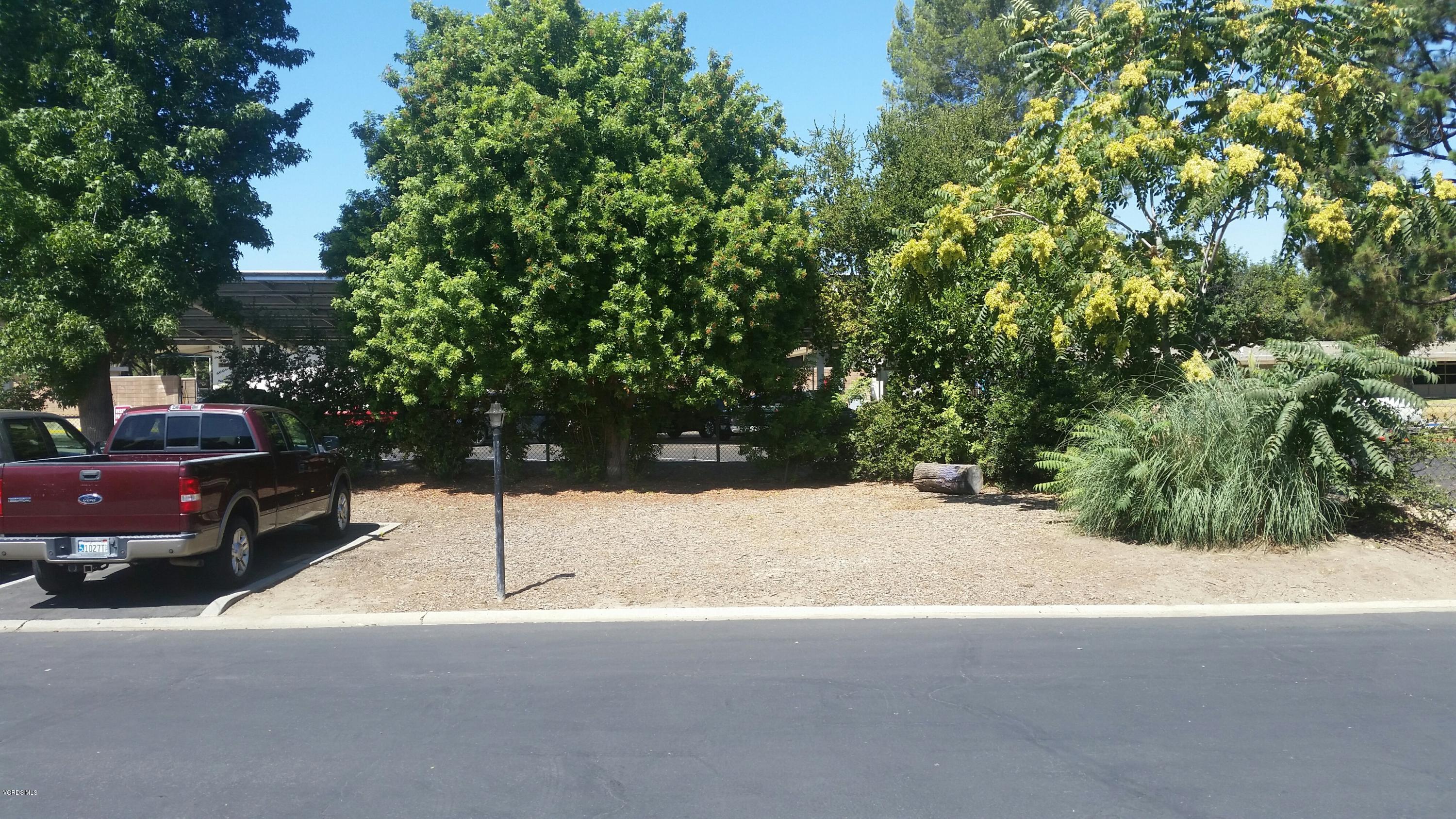 6480 Katherine Road, Unit 23 Simi Valley, CA 93063 - Photo 4 of 37 a street view along with trees