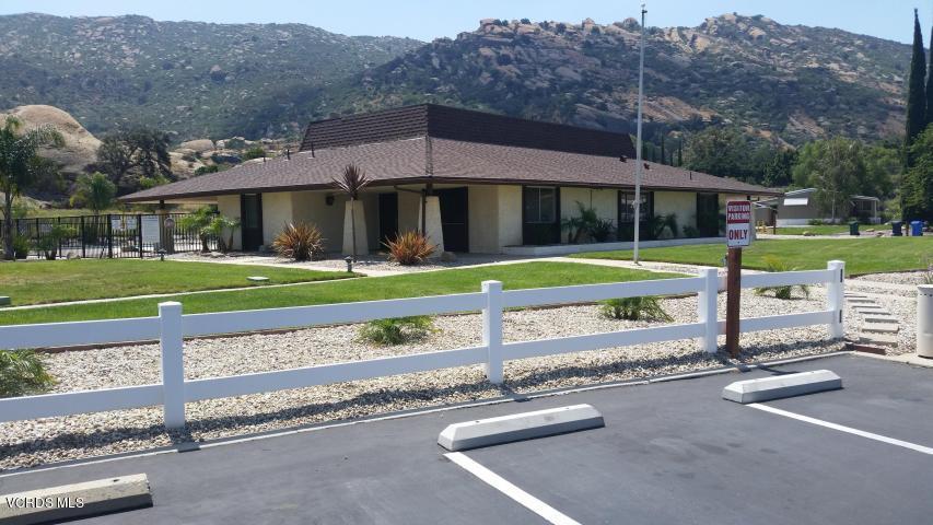 6480 Katherine Road, Unit 23 Simi Valley, CA 93063 - Photo 35 of 37 a view of a house with a yard and sitting area