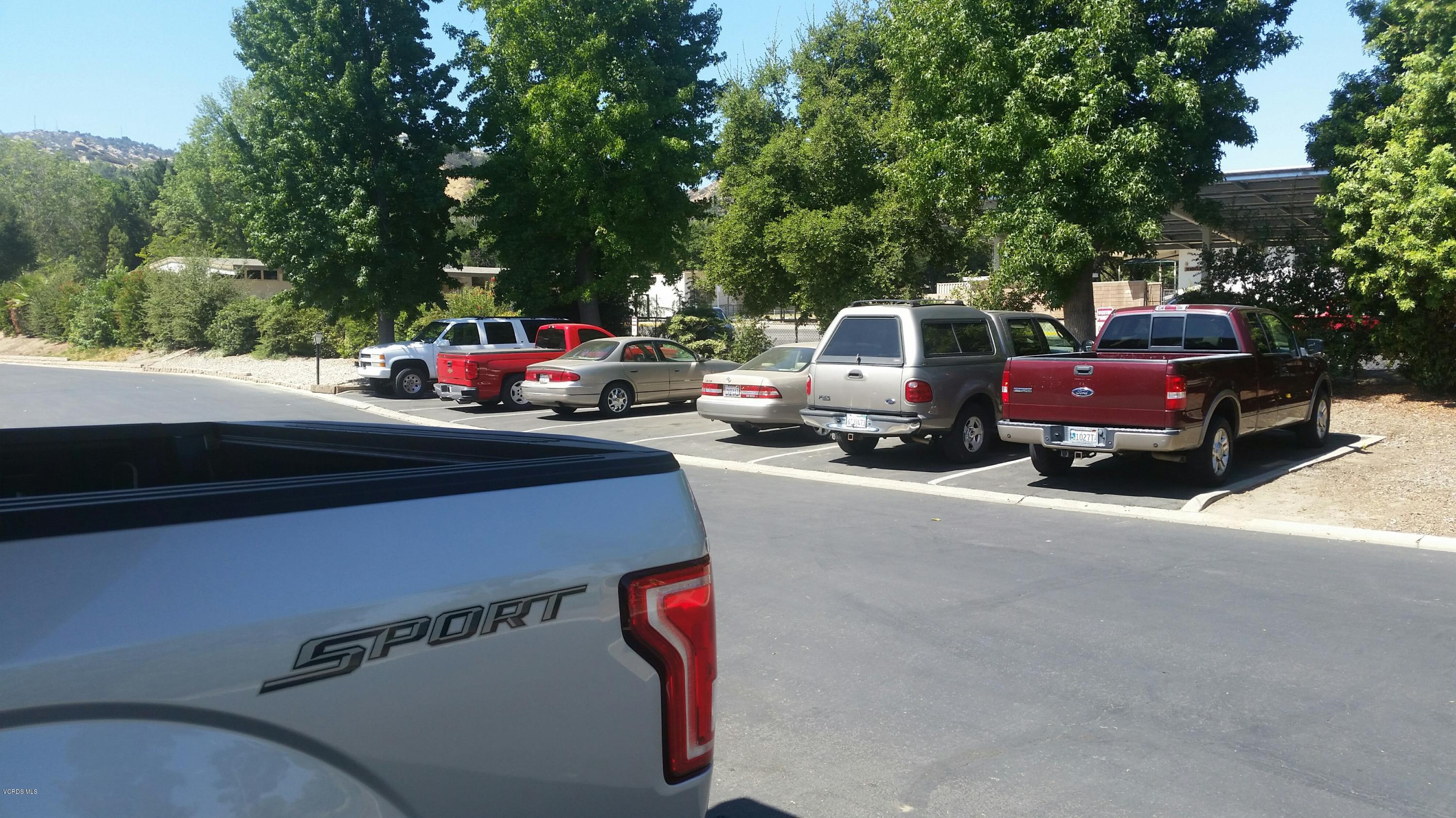 6480 Katherine Road, Unit 23 Simi Valley, CA 93063 - Photo 5 of 37 a cars parked on the side of a street