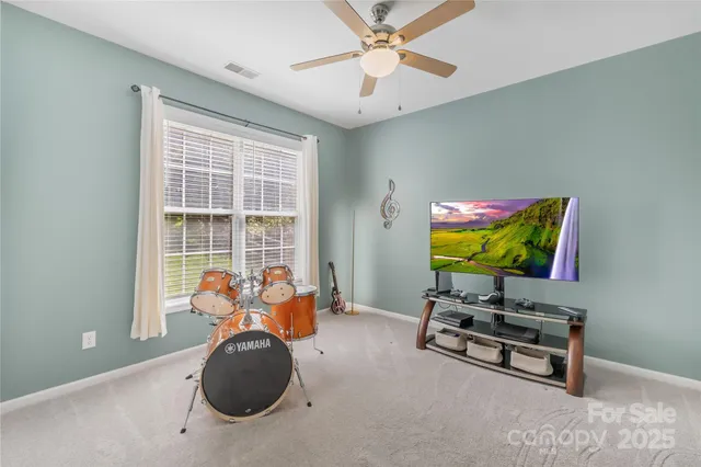 a bathroom with a sink vanity mirror and toilet