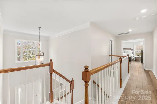a living room with furniture a flat screen tv and a window