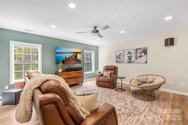 a bed room with a bed and a chair