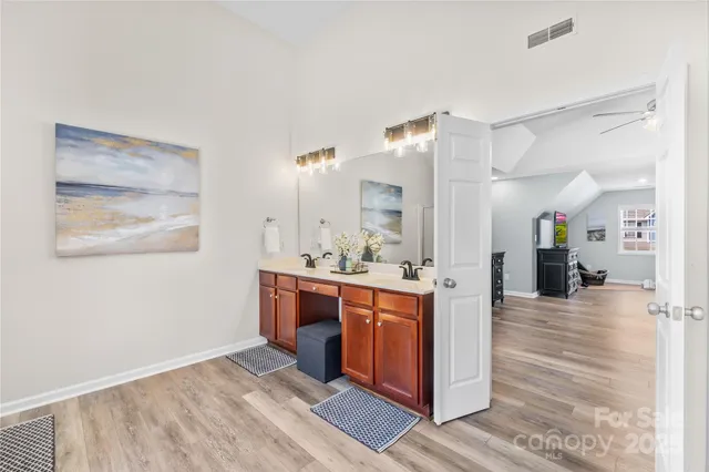 a bathroom with a bathtub and a window