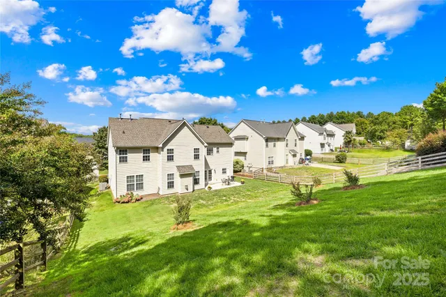 a backyard of a house with lots of green space