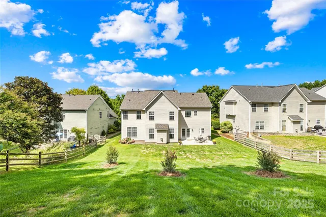 a dining room with furniture entryway and wooden floor