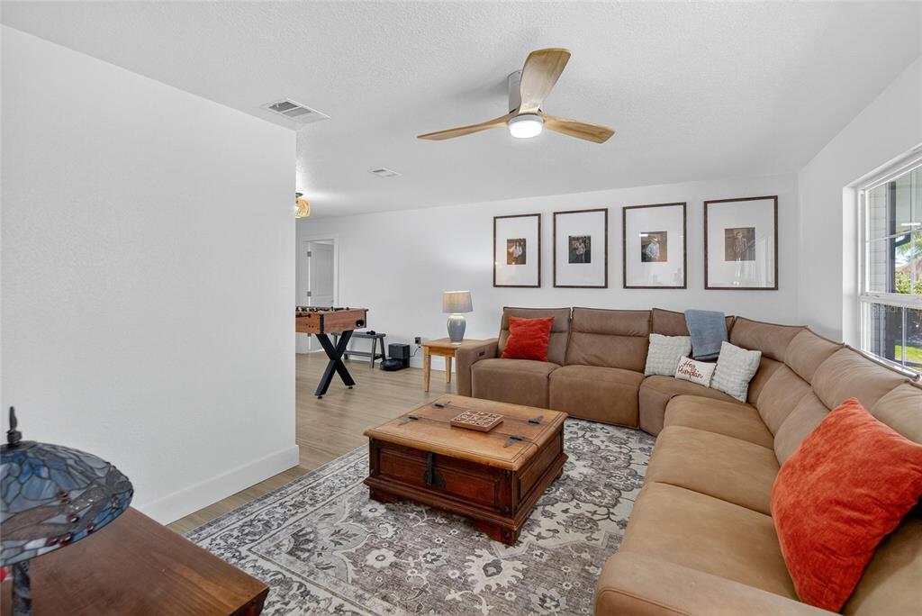 6337 Cocoa Lane Apollo Beach, FL 33572 - Photo 12 of 39 a living room with furniture and a rug