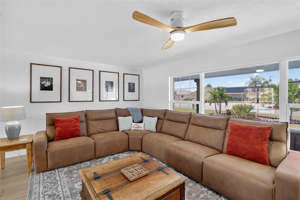 6337 Cocoa Lane Apollo Beach, FL 33572 - Photo 13 of 39 a living room with furniture and a large window
