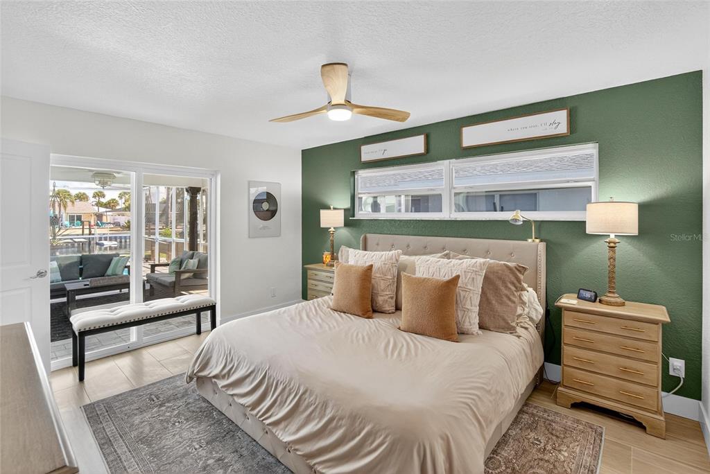 6337 Cocoa Lane Apollo Beach, FL 33572 - Photo 15 of 39 a bedroom with a bed and wooden floor