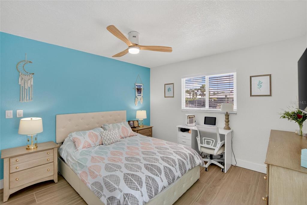 6337 Cocoa Lane Apollo Beach, FL 33572 - Photo 20 of 39 a bedroom with a bed and a dresser