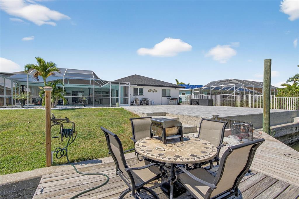 6337 Cocoa Lane Apollo Beach, FL 33572 - Photo 28 of 39 a view of a patio with couches table and chairs and potted plants
