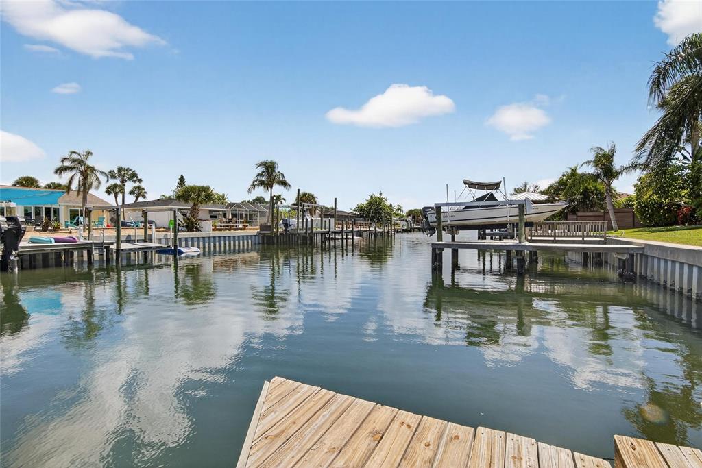 6337 Cocoa Lane Apollo Beach, FL 33572 - Photo 31 of 39 a view of a lake with boats and trees in the background