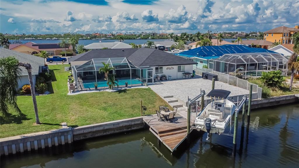 6337 Cocoa Lane Apollo Beach, FL 33572 - Photo 32 of 39 an aerial view of a house with swimming pool a patio and lake view