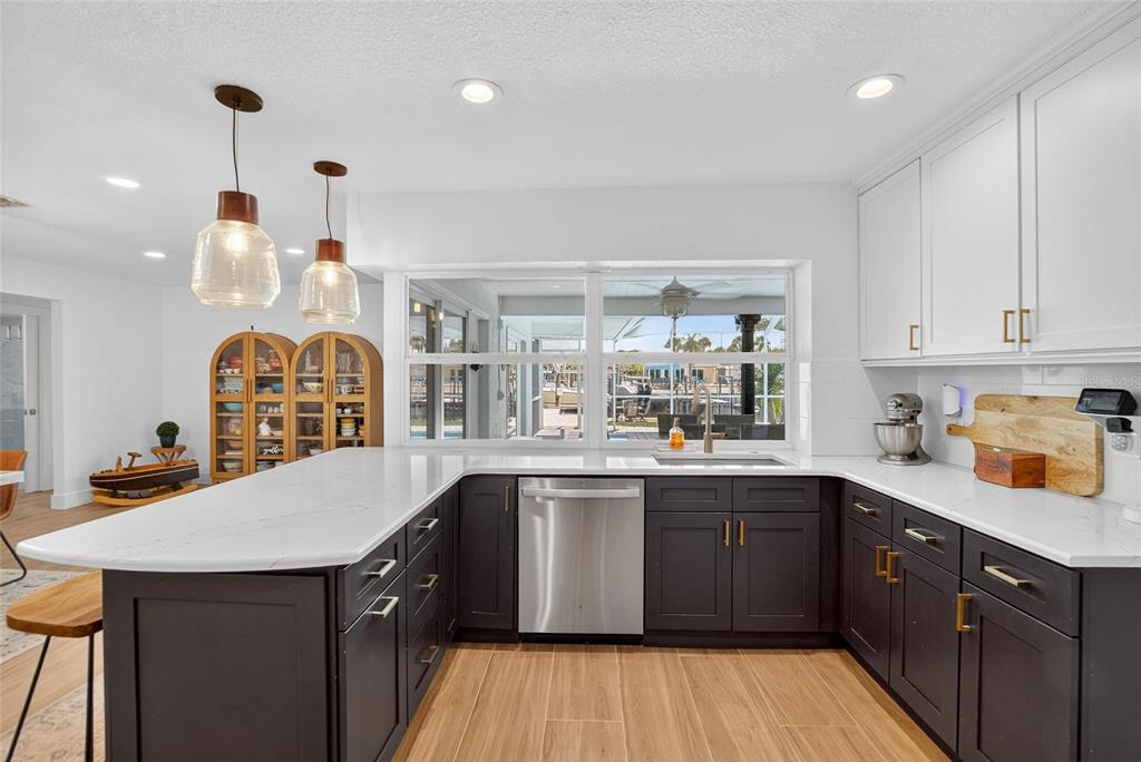 6337 Cocoa Lane Apollo Beach, FL 33572 - Photo 5 of 39 a kitchen with a sink stove and cabinets