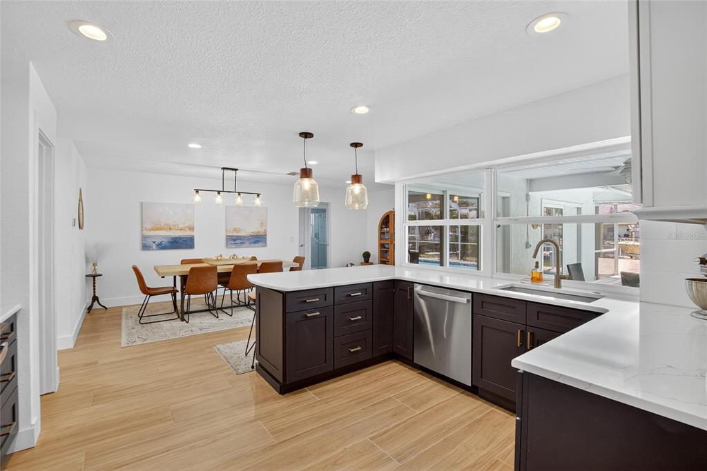 6337 Cocoa Lane Apollo Beach, FL 33572 - Photo 6 of 39 a large kitchen with lots of counter space and a sink