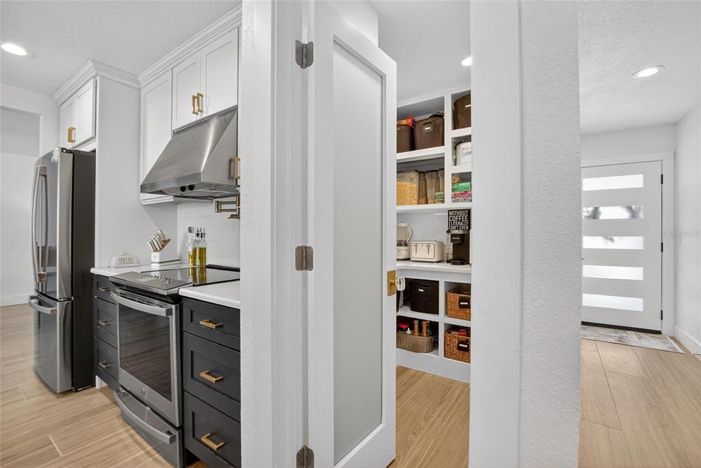 6337 Cocoa Lane Apollo Beach, FL 33572 - Photo 9 of 39 a kitchen with stainless steel appliances granite countertop a refrigerator and a sink