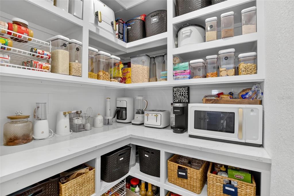 6337 Cocoa Lane Apollo Beach, FL 33572 - Photo 10 of 39 a kitchen with stainless steel appliances granite countertop a microwave and a sink