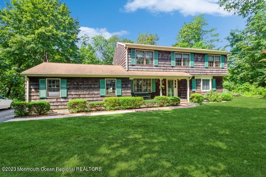 a front view of a house with a yard table and chairs