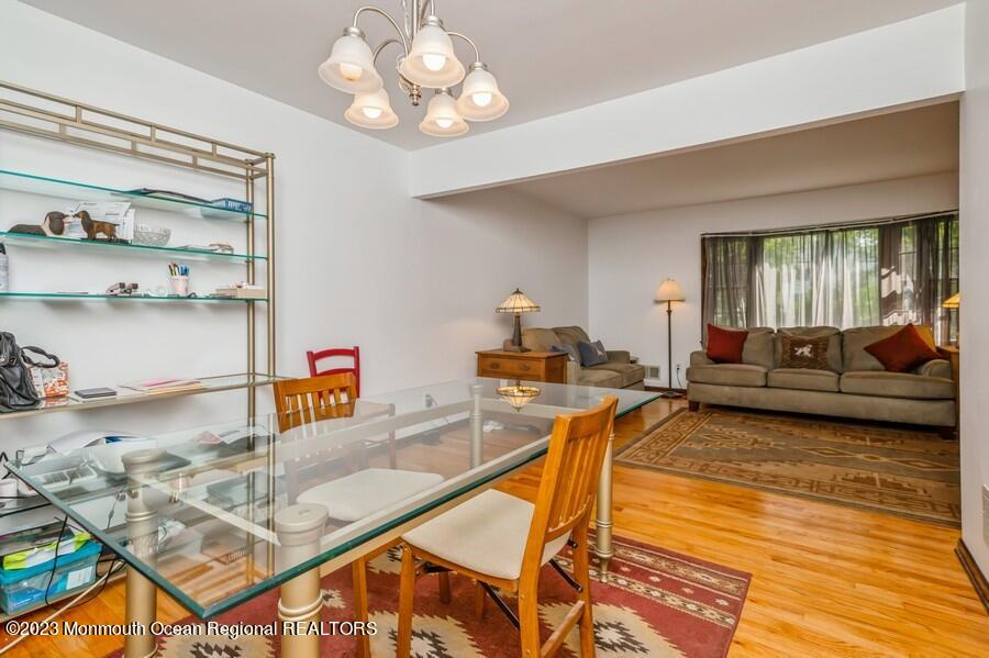 1711 Glendola Road Wall, NJ 07719 - Photo 12 of 25 a living room with furniture and a kitchen view